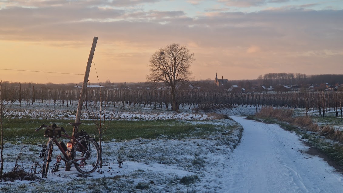 A red bicycle on a snowy backdrop